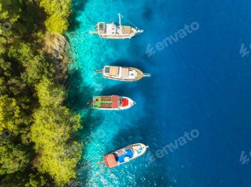 Preview: Aerial view of yachts and boats on the sea at sunset in summer