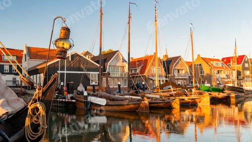 Preview: Urk Flevoland Netherlands sunset at the lighthouse and harbor of Urk Holland