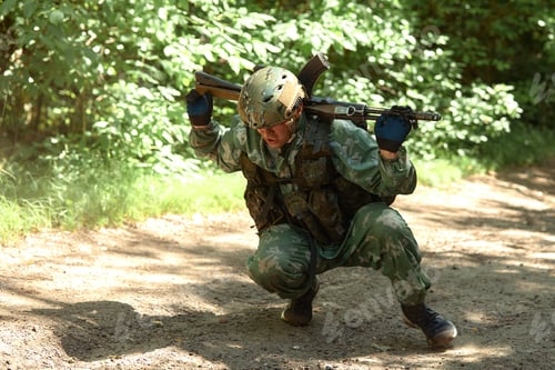 Preview: Special forces soldier with weapon take part in military maneuver. War, army, technology and people