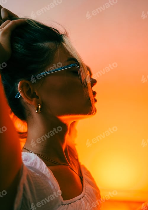 Preview: Portrait of attractive caucasian woman fashion model in eyeglasses and white dress posing