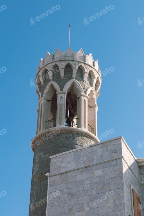 Preview: Medieval stone tower with arched openings and crenellations in Piran, Adriatic coast