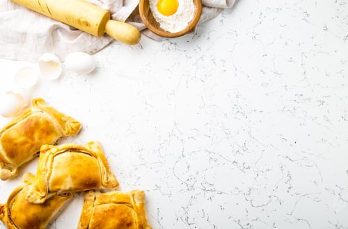 Preview: Chilean EMPANADAS DE PINO. Independence day baking concept. Empanadas on white background