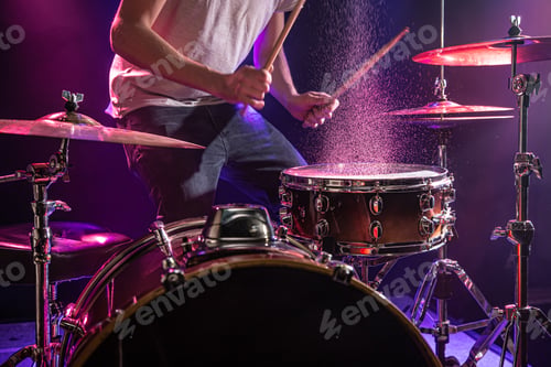 Preview: The drummer plays the drums.