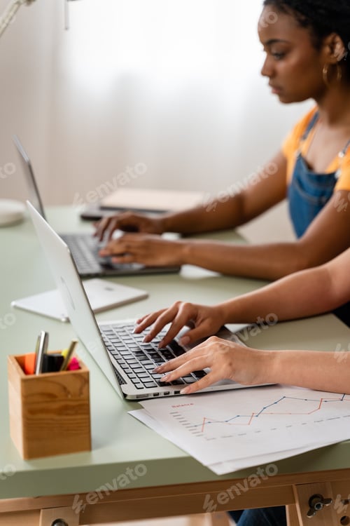 Preview: Two women studying at home.