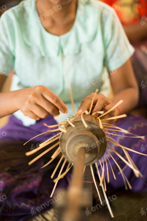 Preview: Artisan skillfully crafting a traditional object.