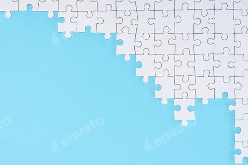 Preview: flat lay with white puzzle pieces on blue background