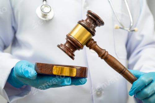 Preview: Doctor holding judge gavel, forensic medicine, medical law and crime justice.