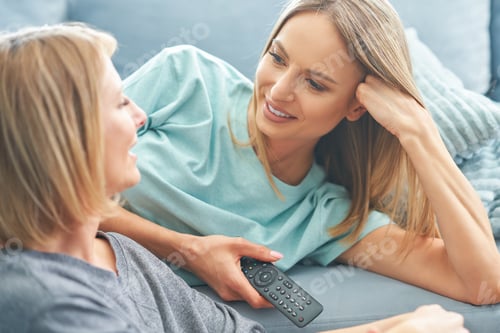 Preview: Two girl friends or lgbt couple in living room