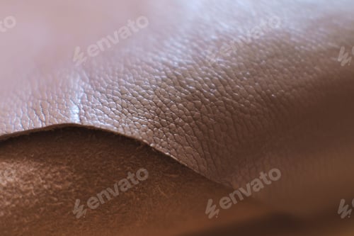 Preview: detailed view of a luxurious brown leather piece, highlighting the intricate patterns and natural