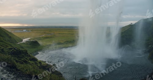 Preview: Close up of beautiful Seljalandfoss waterfall by sunset, Iceland