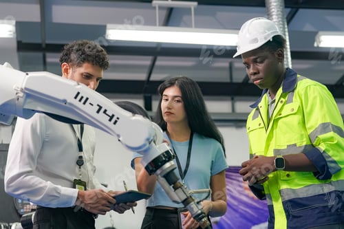 Preview: Robotic Arm engineer check on equipment in its with software of Artificial Intelligence Unit.
