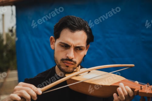 Preview: Focused Lyre Player Following The Music