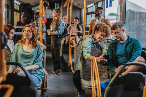 Preview: Passengers using mobile phone and riding on city bus