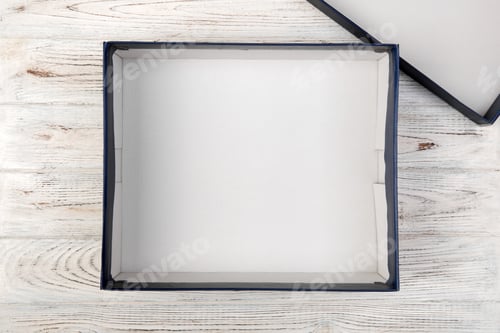 Preview: A empty blank white box on the desk top view on white wooden background