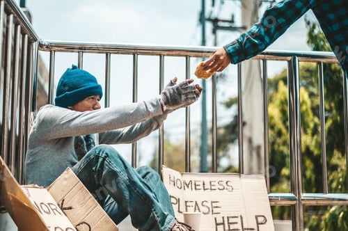 Preview: The man sitting begging on an overpass.