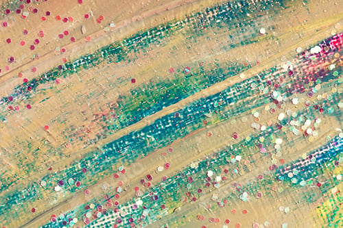Preview: Abstract painted colorful background with scattered confetti.