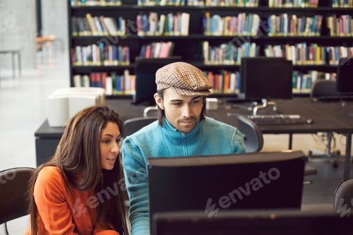 Preview: Students finding information for study on computer in library