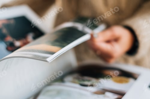 Preview: Woman flips through magazine pages