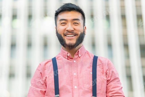 Preview: Close up portrait of a asian man smiling outside
