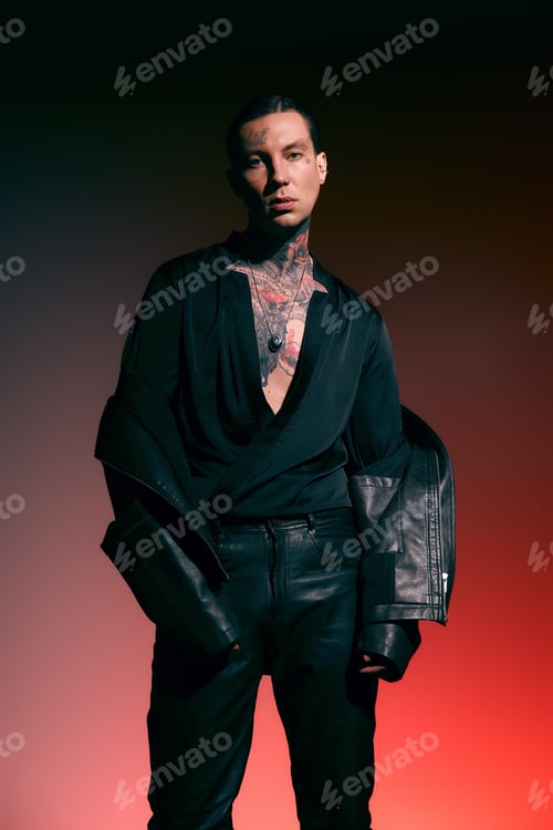 Preview: Stylish young man in a striking pose showcases modern fashion with confidence