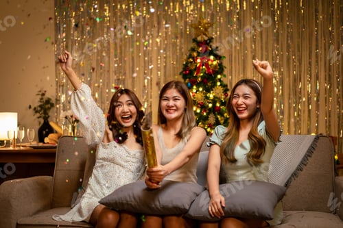 Preview: beautiful people is sitting on the couch to playing and shooting firecracker or poppers confetti