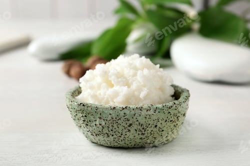 Preview: Shea butter in bowl on white table, closeup