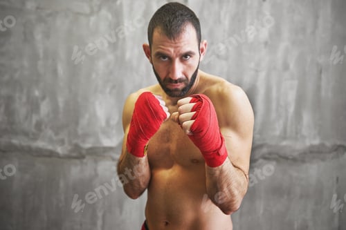 Preview: Shot of wrapped hands with red boxing tape of young boxer fight