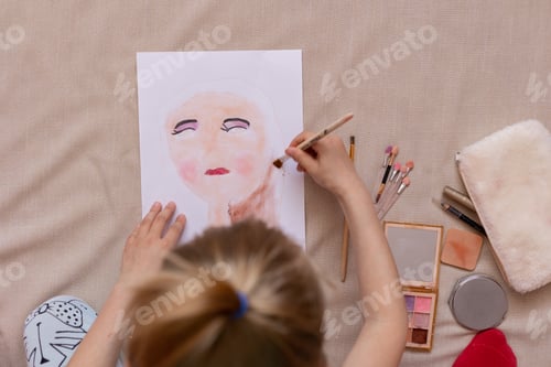Preview: Child Drawing Makeup Portrait with Brushes at Home