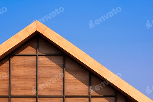 Preview: Vntage wooden gable roof with battens decoration against blue clear sky background