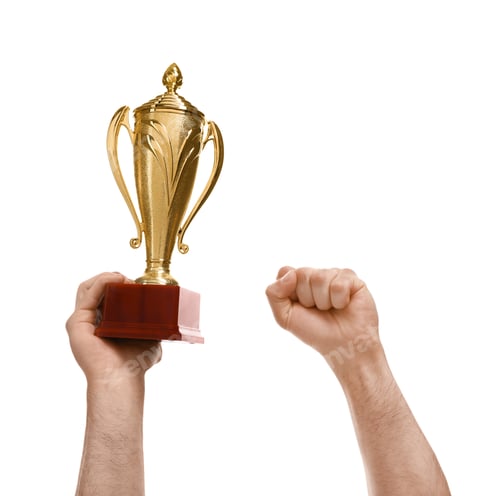 Preview: Young man holding gold trophy cup on white background, closeup