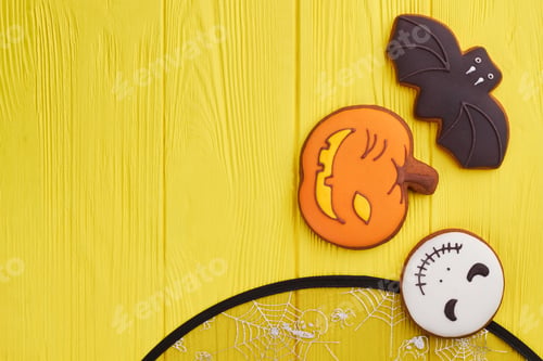 Preview: Assorted Hallowen cookies on yellow background.