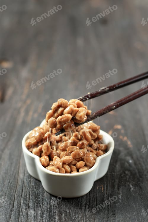 Preview: Natto Lifted with Chopstick. Natto is Japanese Fermented Sticky Soy Beans with Stinky Smell