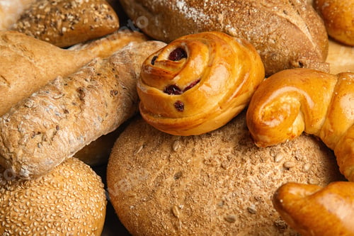 Preview: Fresh breads and pastries as background, closeup