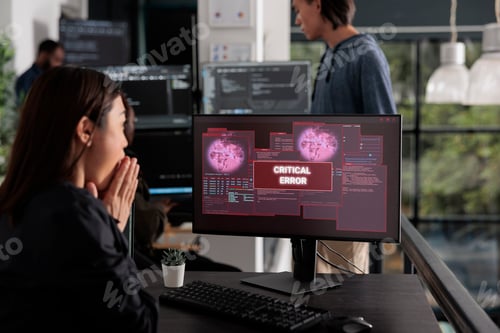 Preview: Shocked programmer typing html code encountering hacking alert on compute