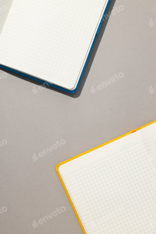 Preview: Open notebooks lie on a light background