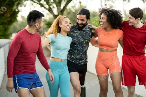 Preview: group of multiracial sporty friends happy as they start their training outdoors.