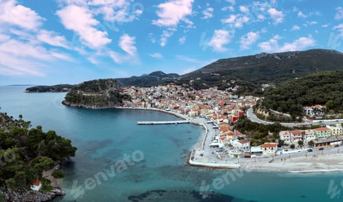 Preview: Parga Epirus Greece. Aerial drone view of waterfront Ionian city, coastal road, transparent sea.