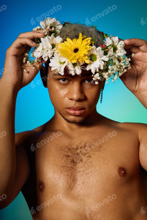 Preview: Young man in a floral crown and dyed hair highlights beauty and diversity