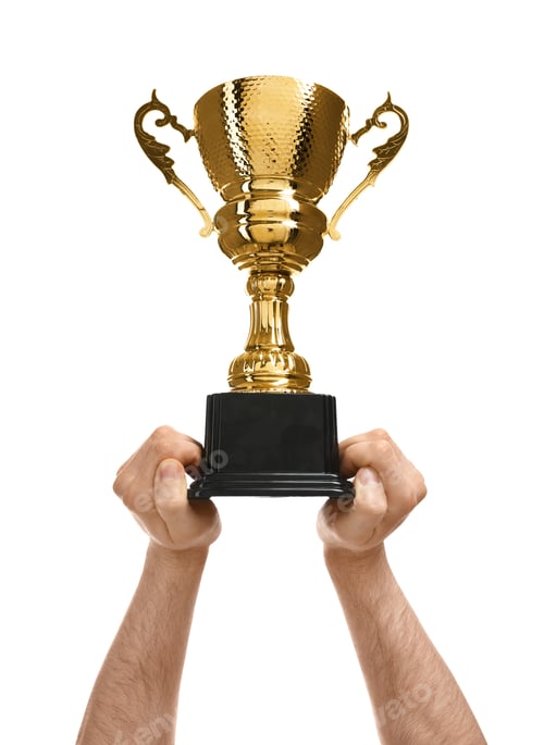 Preview: Young man holding gold trophy cup on white background, closeup