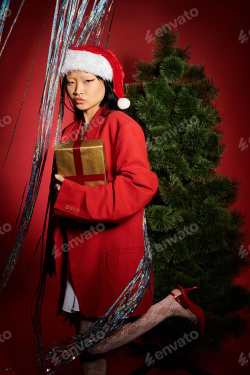 Preview: A festive celebration with a beautiful Asian woman in a vibrant red outfit and Santa hat
