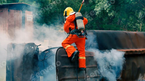 Preview: Firefighter fighting with flame using fire hose chemical water foam spray engine