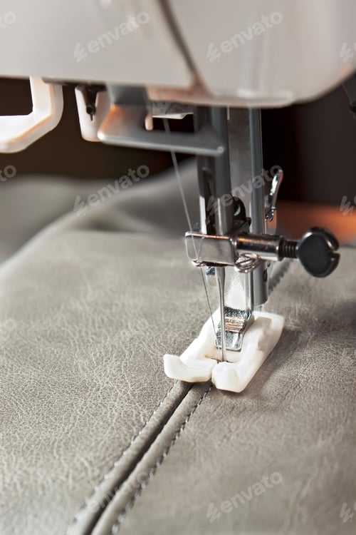 Preview: Modern sewing machine presser foot and item of clothing