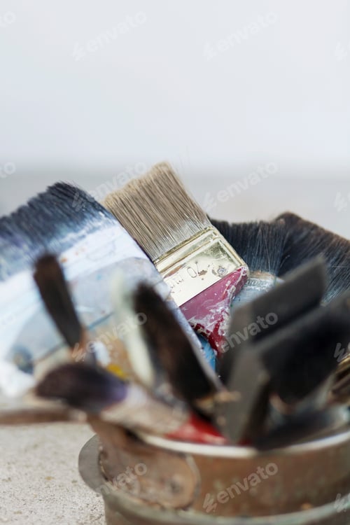 Preview: Paint brushes in container at art studio