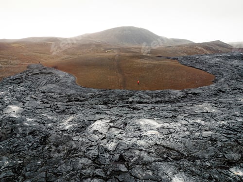 Preview: Black lava rocked somewhere in Iceland on a cloudy autumn day
