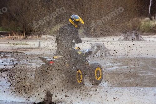 Preview: athlete rides a quad bike on the beach