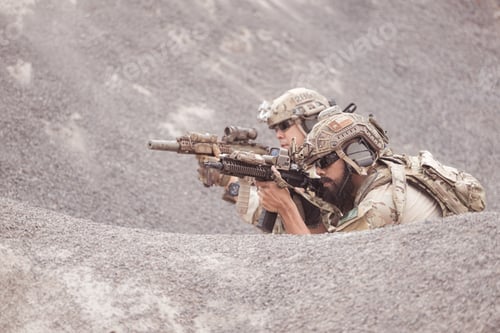 Preview: Soldiers in camouflage military uniforms carrying weapons Reconnaissance missions in rugged mountain