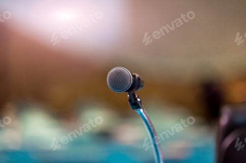 Preview: Microphone in concert hall or conference room soft and blur style for background.