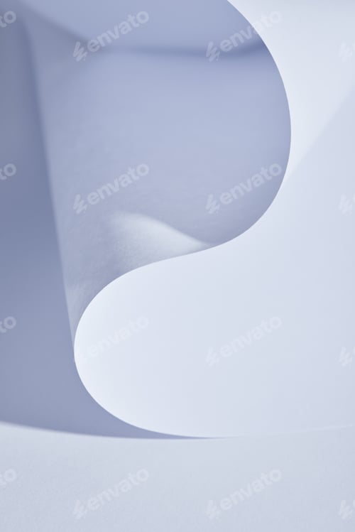 Preview: close up view of curved paper sheet on white background