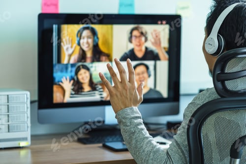 Vista previa: Rear View of Asian Business man say hello with teamwork colleague in video conference