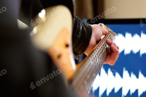 Preview: Man playing chord on electric guitar
